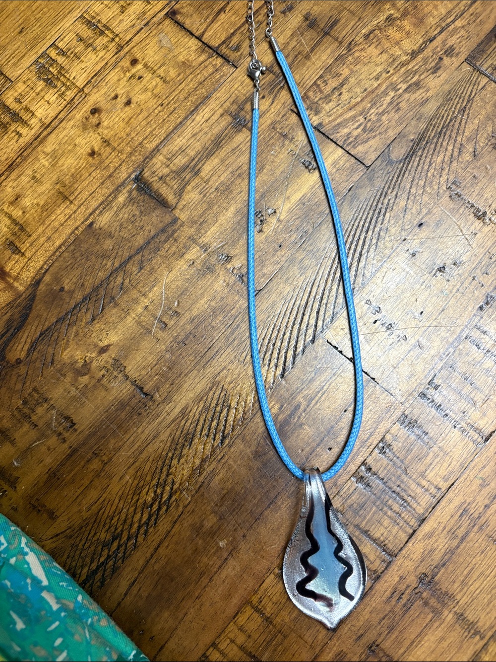 Murano type blown glass teardrop pendant with pretty blue silk cord necklace.